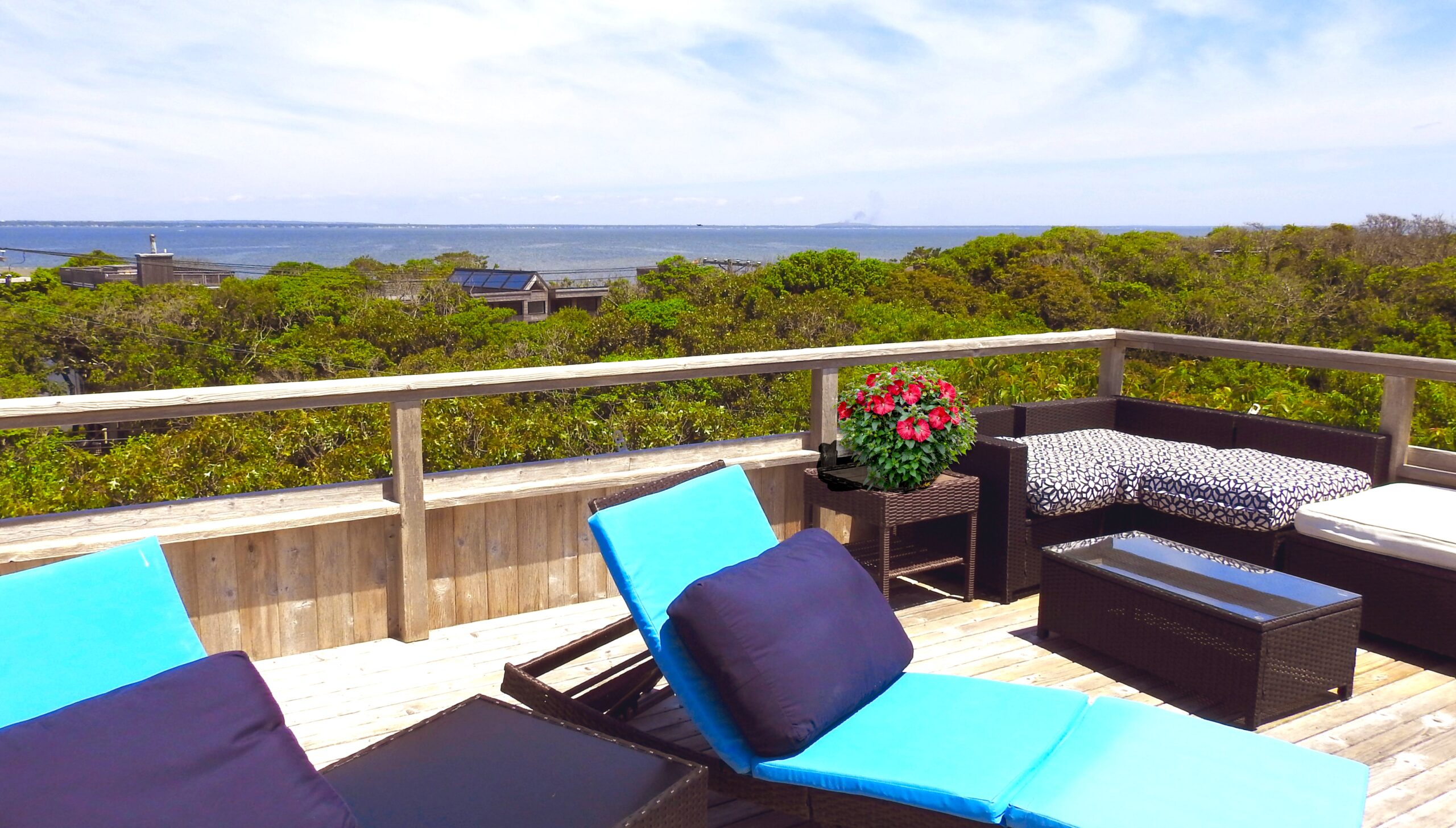 View of the Great South Bay and Blue Coral Reef Colored lounge chairs